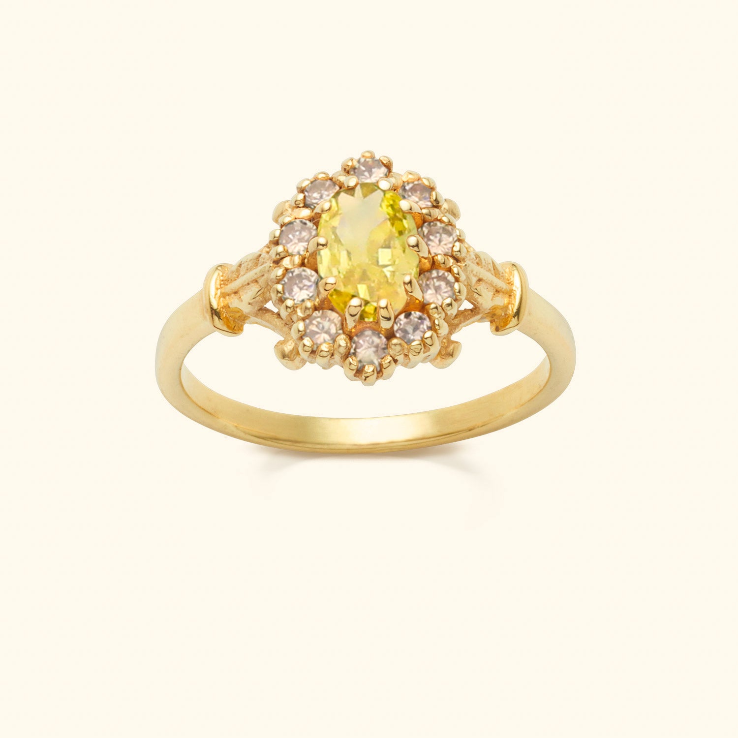 Vintage geïnspireerde goudkleurige ring met gele steen en zirconia in bloemvorm