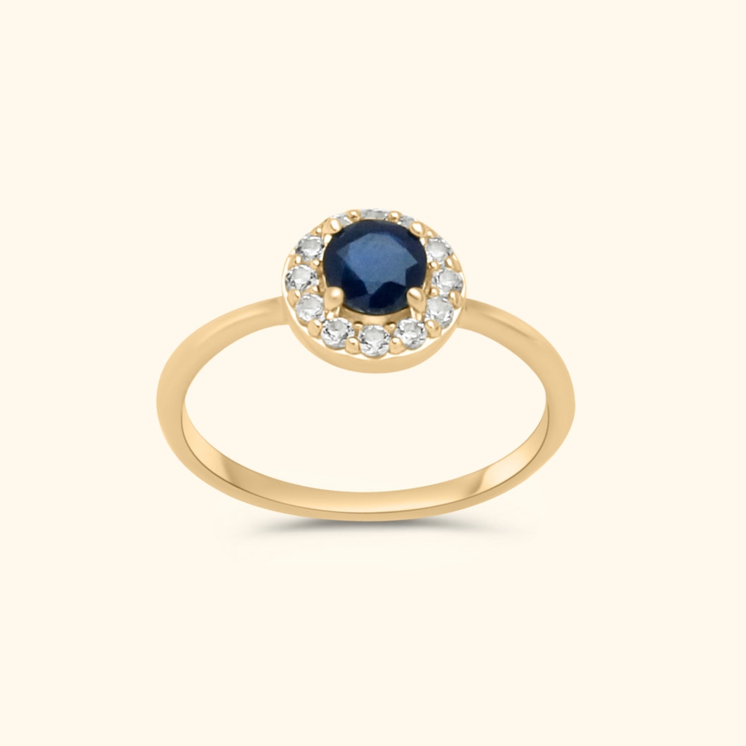 10 karaat gouden ring met blauwe saffier en witte topaas steentjes – luxe en tijdloos sieraad.